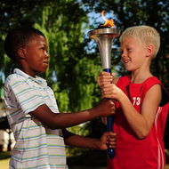 Two students with the harmony torch